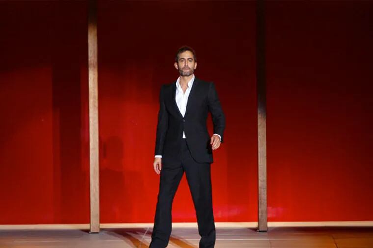 Marc Jacobs greets the crowd after showing his Spring 2013 collection during Fashion Week in New York, Monday, Sept. 10, 2012.  (AP Photo/Seth Wenig)