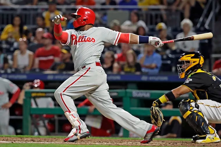Phillies first baseman Carlos Santana watches a two-run double off Pirates relief pitcher Josh Smoker during the seventh inning of the Phillies' win on Friday.