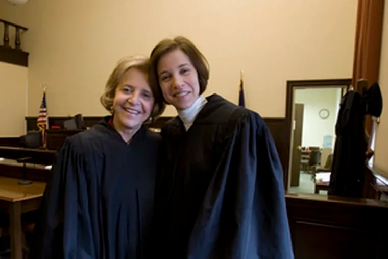 Phyllis Beck (left) and Alice Beck Dubow, the first mother-daughter judges in Pennsylvania. Dubow wears her mother’s robes in Family Court. “Her voice is always in my head,” she said.