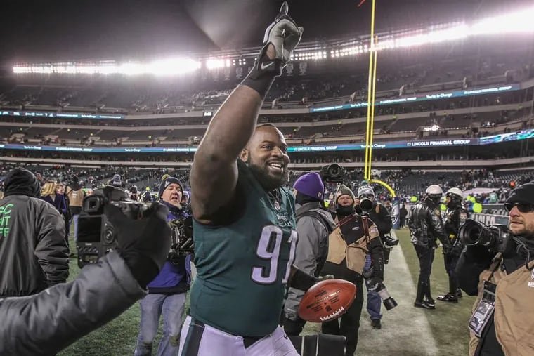 Eagle defensive tackle Fletcher Cox runs off the field celebrating the Eagles victory over the Falcons in the NFC Divisional playoff game on Saturday January 13, 2018. .