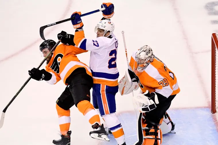 Defenseman Matt Niskanen (left) thinks the Flyers are close to turning the series around. Getting Islanders center Anders Lee out of Carter Hart's kitchen would help.