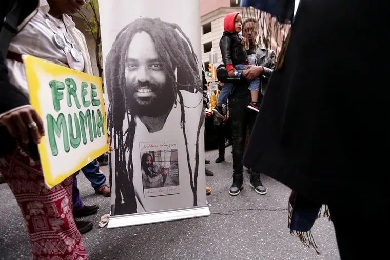Protesters gather outside the Criminal Justice Center after a court hearing for Mumia Abu-Jamal in Philadelphia, PA on October 29, 2018. DAVID MAIALETTI / Staff Photographer