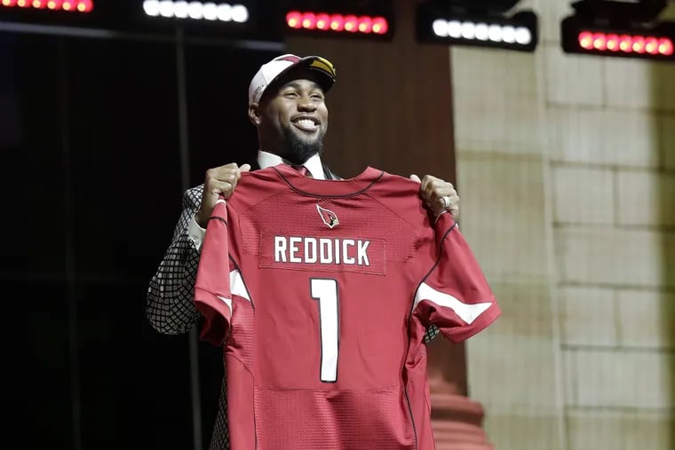 Haason Reddick holds his jersey after getting selected by the Arizona Cardinals 13th during the 2017 NFL draft at the Philadelphia Museum of Art along the Benjamin Franklin Parkway on Thursday, April 27, 2017. YONG KIM / Staff Photographer.
