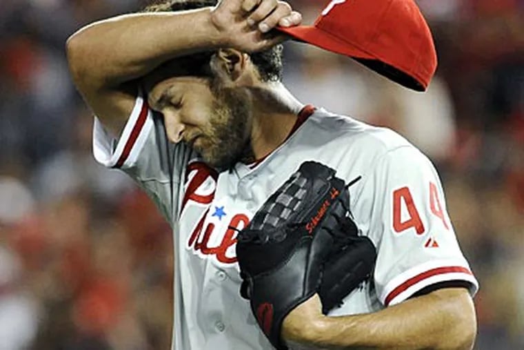Michael Schwimer picked up the loss as the Phillies fell to the Nationals in 11 innings on Friday. (Richard Lipski/AP)