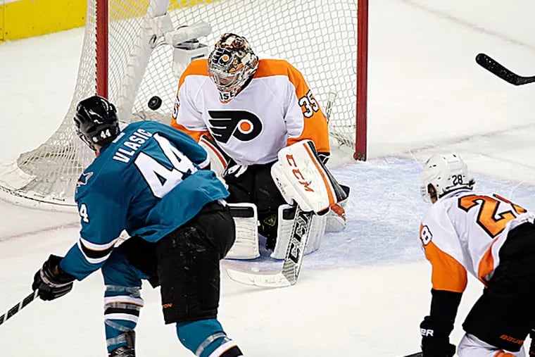 Sharks defenseman Marc-Edouard Vlasic scores past Flyers goalie Steve Mason. (Marcio Jose Sanchez/AP)