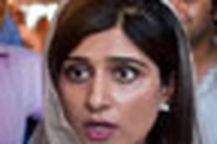 Pakistan's Foreign Minister Hina Rabbani Khar, talks to reporter after her press conference in Islamabad, Pakistan on Monday, May 14, 2012.  Khar indicated Monday the time has come to reopen the country's Afghan border to NATO troop supplies, saying the government has made its point by closing the route for nearly six months in retaliation for a deadly U.S. attack on its troops. (AP Photo/Anjum Naveed)