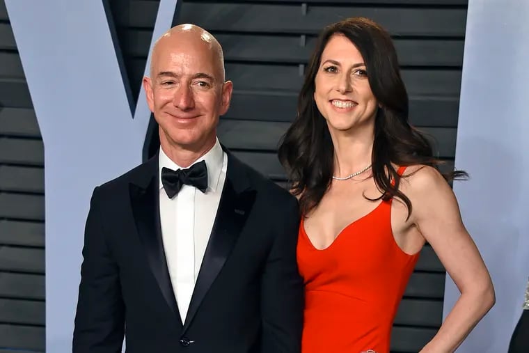 FILE - In this March 4, 2018, file photo, Jeff Bezos and wife MacKenzie Bezos arrive at the Vanity Fair Oscar Party in Beverly Hills, Calif. Jeff Bezos and MacKenzie Bezos announced Thursday, April 4, 2019, in a series of tweets that they have finalized their divorce, ending a 25-year marriage that played a role in the creation of the online shopping giant. (Photo by Evan Agostini / Invision / AP, File)