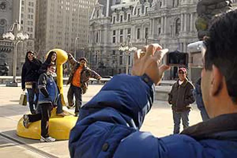 San Juan Hernandez shooting video of his nieces and nephews playing on the sculpture of the MSB Plaza today. They were hoping to see snow while visiting from Puerto Rico. No such luck. It's still cooler than back home, but they'll have to wait till next week's trip to Plymouth, Mass.