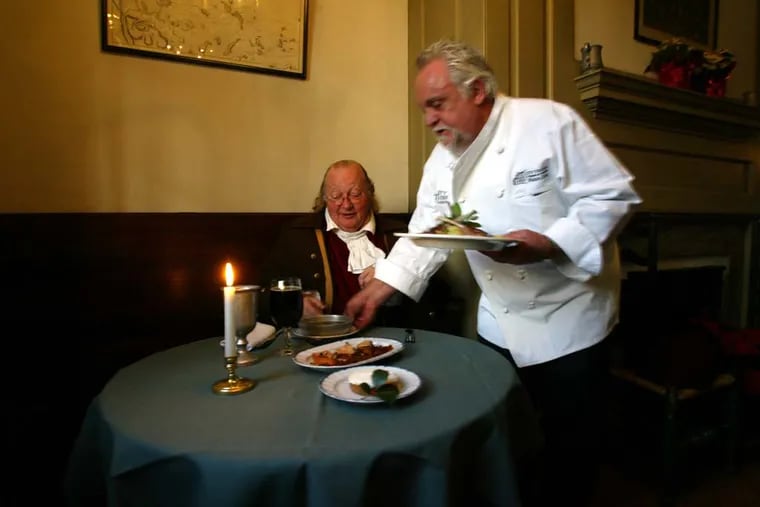City Tavern chef Walter Staib serving Ralph Archbold, a Benjamin Franklin interpreter, in 2005. Staib operated the restaurant from 1994 to 2020.