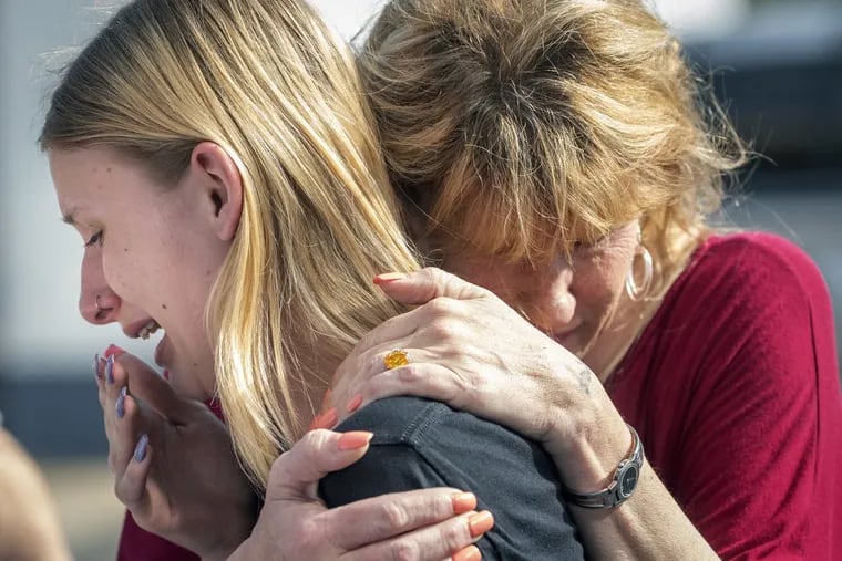 Santa Fe High School student Dakota Shrader is comforted by her mother Susan Davidson following a shooting at the school on Friday.