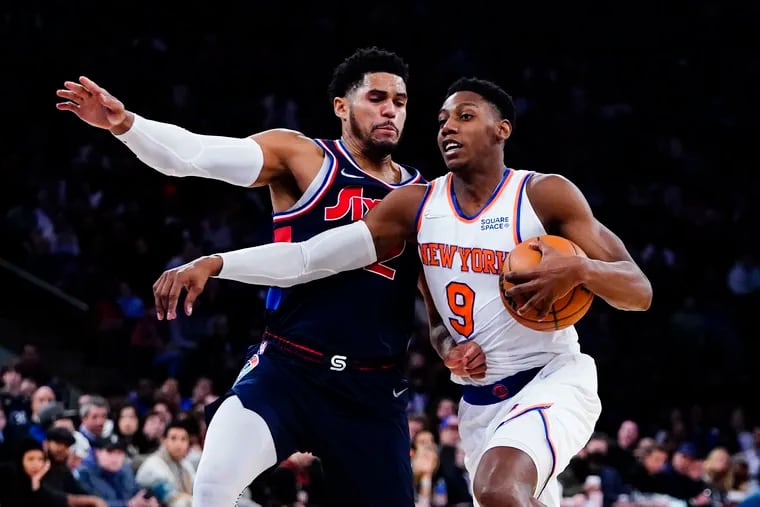 Sixers Tobias Harris, left, defends New York Knicks' RJ Barrett during the second half of an NBA basketball game Sunday.