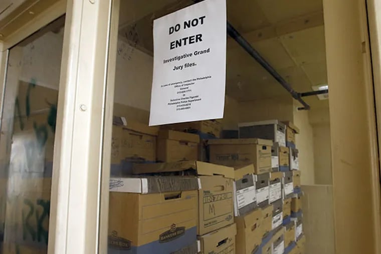 A small room with bulletproof glass and pieces of paper taped to it that reads "DO NOT ENTER / INVESTIGATIVE GRAND JURY FILES," on the seventh floor in City Hall on Monday, July 28, 2014.  ( YONG KIM / Staff Photographer )