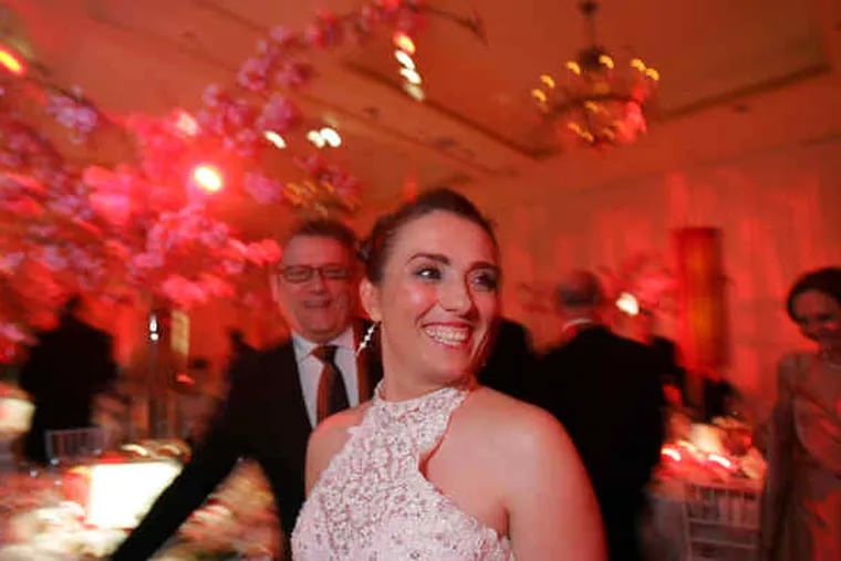 At the Viva la Diva Gala, Brian Kappra of Evantine Design, who donated the decor and flowers for the room at the Four Seasons Hotel, smiles at soprano Ermonela Jaho. The black-tie benefit raised $150,000 for the Opera Company of Philadelphia.