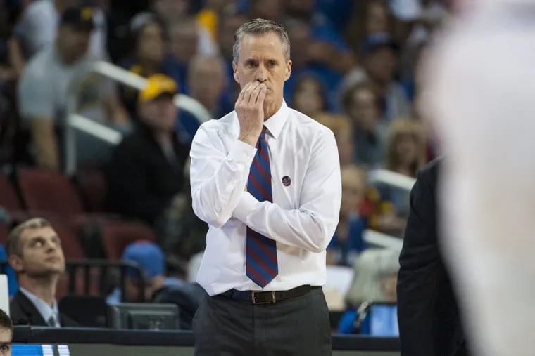 Penn Quakers head coach Steve Donahue watches his team’s 76-60 loss to the Kansas Jayhawks in the NCAA tournament’s first round in Wichita, Kansas.