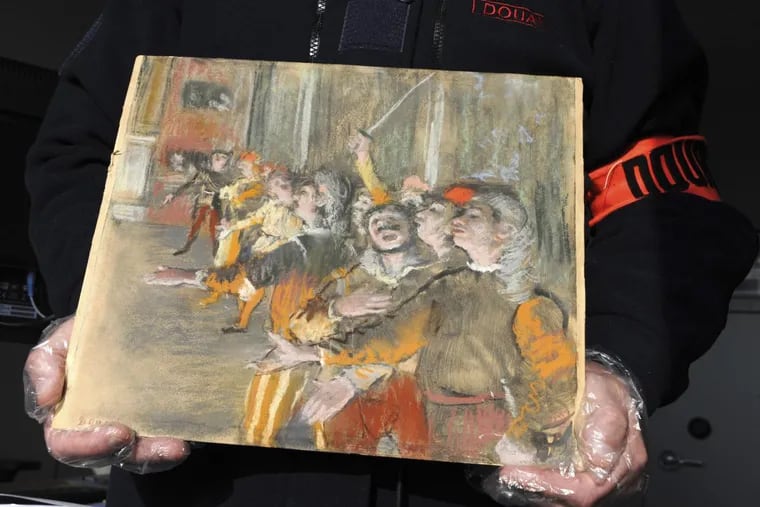 This photo taken Thursday Feb. 22, 2018 and provided by French Customs shows a stolen painting by French painter Edgar Degas. French customs have discovered an original Impressionist masterpiece by Edgar Degas stolen in 2009 in a suitcase on a bus.