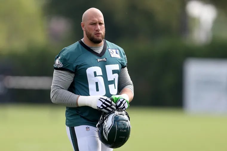 Eagles' Lane Johnson walks across the practice field during Eagles training camp in Philadelphia, PA on August 14, 2018. DAVID MAIALETTI / Staff Photographer