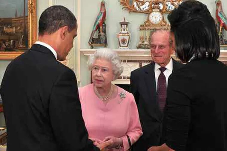 President and Michelle Obama are greeted by Britain's Queen Elizabeth II and Prince Philip at Buckingham Palace. During a private meeting, the Obamas gave the queen a personalized iPod and rare songbook.