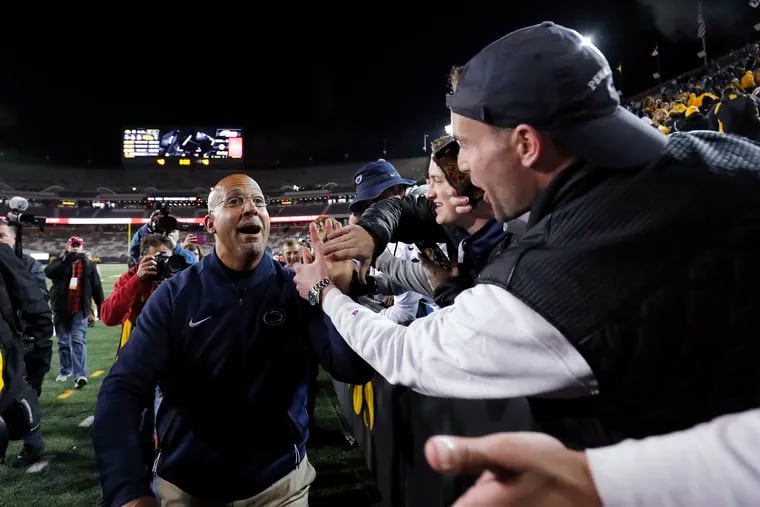 Penn State coach James Franklin celebrates Penn State’s 17-12 victory over Iowa with fans.
