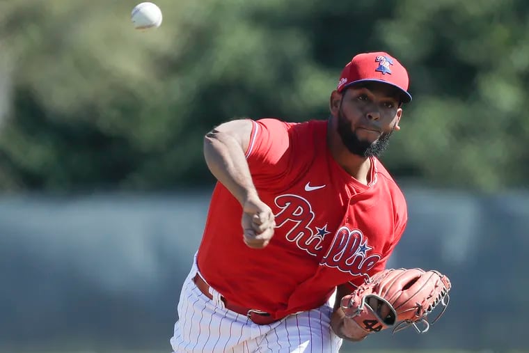 Phillies pitcher Seranthony Dominguez pitches during a simulated game at the Carpenter Complex on Sunday.