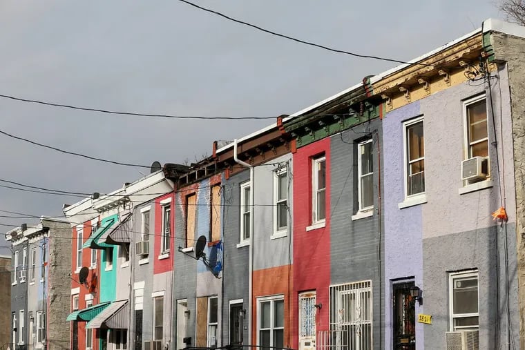 Row homes are pictured in the 3800 block of Melon Street in West Philadelphia on Tuesday, Jan. 16, 2018.
