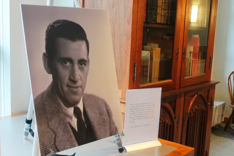 A previously unseen photo of author J.D. Salinger is displayed at the University of New Hampshire in Durham, N.H., on Tuesday, Jan. 22, 2019. The photos taken for the book jacket of Salinger's 1951 novel, "Catcher in the Rye," were among nearly 50,000 images bequeathed to the university by German photographer Lotte Jacobi.