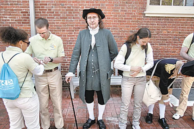 Bob Gleason, portraying William Penn, remains in character as Once Upon a Nation students line up for their graduation ceremony from the Benstitute.