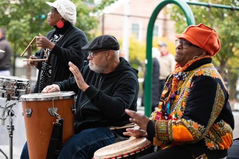 Musicians (from left) Janet McDonald, Tom Lowery, and Karen Smith perform for attendees at a cultural celebration for the Bethel Burial Ground Memorial Project on Saturday at Weccacoe Playground in Queen Village, Philadelphia. The project is intended to honor the lives of 5,000 Black Philadelphians who are buried beneath the playground.