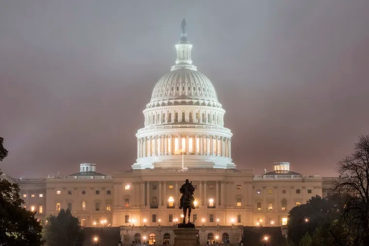 The U.S. Capitol Building in Washington is shrouded in fog early in the morning Tuesday, Nov. 6.