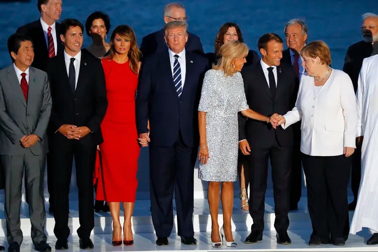 (From left) Japanese Prime Minister Shinzo Abe, Canadian Prime Minister Justin Trudeau, first lady Melania Trump, President Donald Trump, Brigitte Macron, French President Emmanuel Macron, and German Chancellor Angela Merkel during the G-7 summit on Sunday.