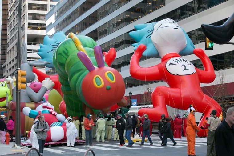 Balloons and balloon handlers gather at 19th street and Market Streets prior to the start of the 98th Annual 6ABC Dunkin' Donuts Thanksgiving Day Parade, Thursday, Nov. 23, 2017.