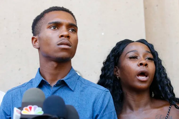 Iesha Harper, right, answers a question during a news conference as she is joined by her fiancee Dravon Ames, left, at Phoenix City Hall, Monday, June 17, 2019, in Phoenix. Ames and his pregnant fiancée, Harper, who had guns aimed at them by Phoenix police during a response to a shoplifting report say they don't accept the apologies of the city's police chief and mayor and want the officers involved to be fired.(AP Photo/Ross D. Franklin)