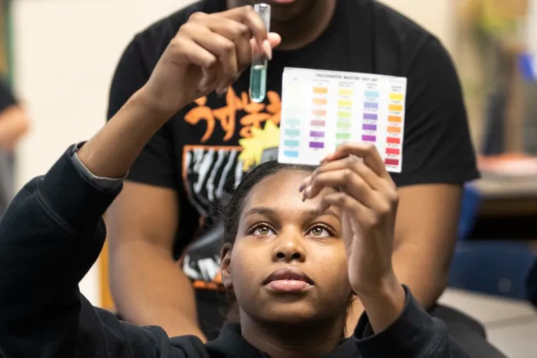 Milan Flowers test water samples in her environmental science class at Lankenau High School. Flowers and her classmates are growing mussels that they will eventually release into the Schuylkill River to help clean Philadelphia's water.