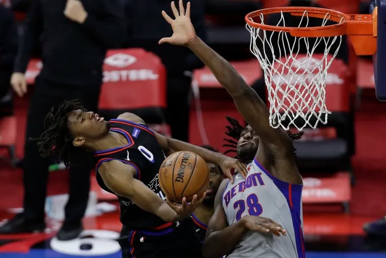 Sixers guard Tyrese Maxey gets fouled driving to the basket against Detroit Pistons center Isaiah Stewart during the fourth quarter on Saturday, May 8, 2021.