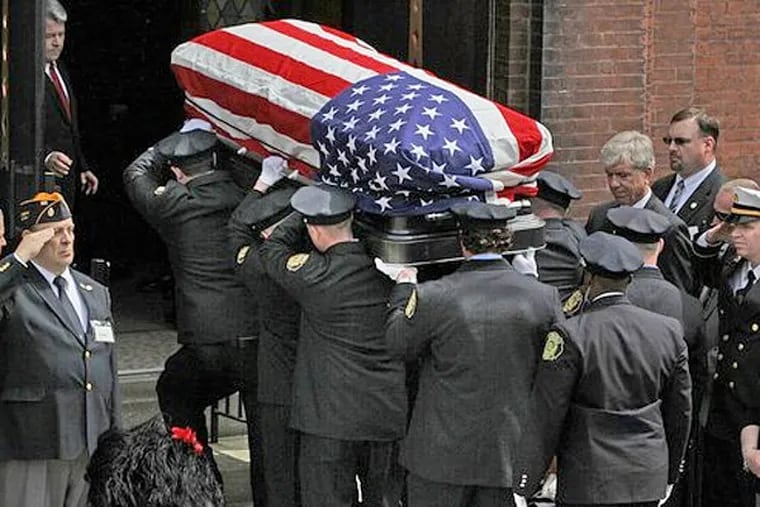 The casket of Philadelphia Fire Capt. Michael Goodwin is taken into St. Michael's Church in Kensington on Thursday morning. (MICHAEL BRYANT / Staff Photographer)