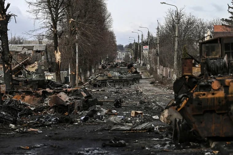 Destroyed Russian armored vehicles in the city of Bucha, west of Kyiv, on Friday.