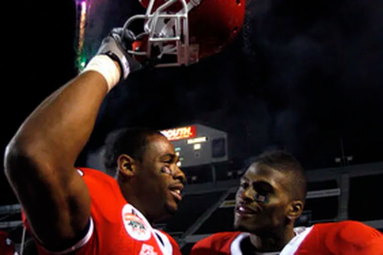 Rutgers receivers Kenny Britt and Tiquan Underwood (7) celebrate after beating North Carolina State, 29-23.