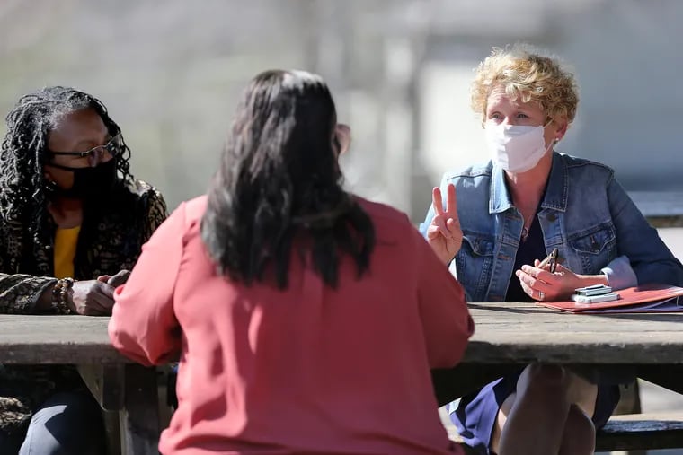 U.S. Rep. Chrissy Houlahan (D., Pa.), right, speaks with Cheryl Miles, left, of Good Samaritan Services and Black Women of Chester County in Action, and Guillermina Rios, center, senior director of programs and membership at the YMCA of Greater Brandywine, during an April 5 event at Anson B. Nixon Park in Kennett Square.