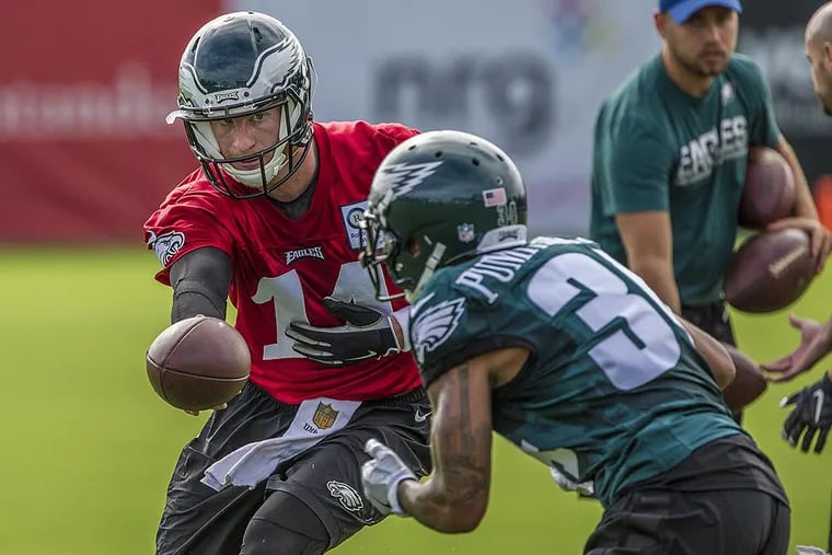 Eagles quarterback Carson Wentz hands the ball off to rookie running back Donnel Pumphrey.