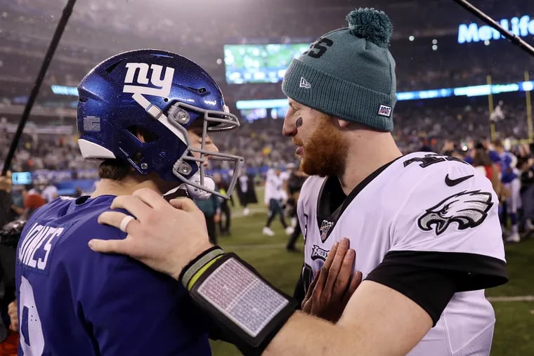 Eagles quarterback Carson Wentz (11) shakes hands with New York Giants quarterback Daniel Jones (8) after a game at MetLife Stadium in East Rutherford, N.J., on Sunday, Dec. 29, 2019. The Eagles won 34-17.