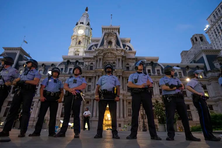 Police on the west side of City Hall before the start of an 8 p.m. curfew following the Justice For George Floyd Philadelphia Protest on May 30, 2020. This month, Philadelphia imposed an earlier curfew for teenagers during the summer, in an effort to curb juvenile crime. Was this a good idea?