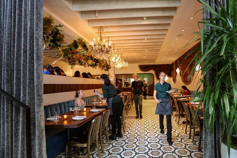 Liz Kleppinger (right) heads toward the outdoor dining section of the Wilder Restaurant in Philadelphia. While the U.S. as a whole saw leisure and hospitality jobs up 3.9% in July 2023, it was up by 8.9% in the Philadelphia region.