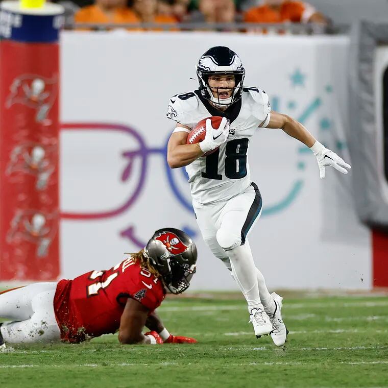 Eagles receiver Britain Covey breaks into the clear on a punt return past Tampa Bay's fallen J.J. Russell.