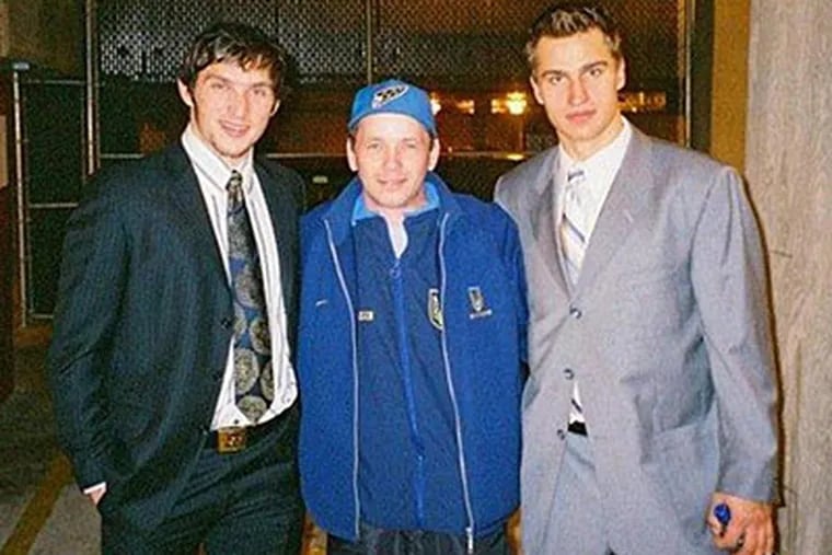 Ivan Pravilov was well-known in hockey circles. Here, he's with Capitals star Alex Ovechkin (left) and former Flyer Dainius Zubrus.