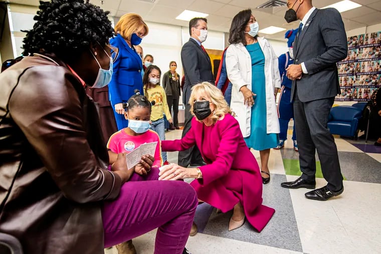 First Lady Jill Biden interacts with a family and their young children on Friday during a visit at CHOP Karabots Pediatric Care Center in West Philadelphia.