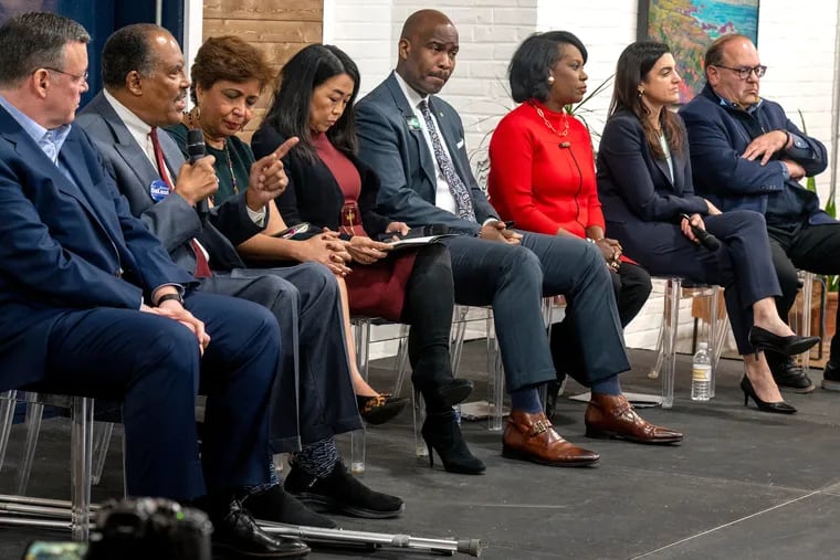 Eight mayoral candidates are on stage during a forum Sunday, Jan. 15, 2023. From left are: Grocery store owner Jeff Brown; retired Municipal Court Judge James DeLeon; former City Councilmembers Maria Quiñones-Sánchez, Helen Gym, Derek Green, and Cherelle Parker; former City Controller Rebecca Rhynhart; and former City Councilmember Allan Domb. DiverseForce and the African American Chamber of Commerce hosted the event with members of the BBeX  Network of professionals (Black and Brown Excellence).