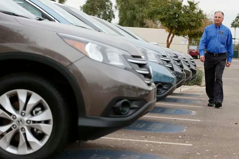 A row of Honda CRVs in Tempe, Ariz. With gas prices dropping, sales of new vehicles could increase next year. Sales are already back to near record-high levels because of easy credit, too.