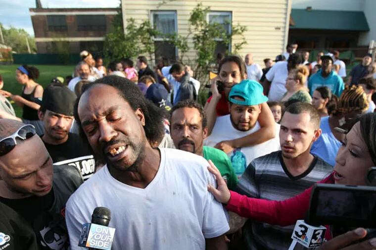 FILE - This May 6, 2013 file photo shows neighbor Charles Ramsey speaking to media near the home where missing women Amanda Berry, Gina DeJesus and Michele Knight were rescued in Cleveland. Ramsey lived next door to where Ariel Castro is alleged to have kept the women in his makeshift prison until Monday afternoon, when Ramsey happened to be home and heard Amanda Berry's scream. (AP Photo/The Plain Dealer, Scott Shaw) MANDATORY CREDIT CLEVELAND PLAIN DEALER