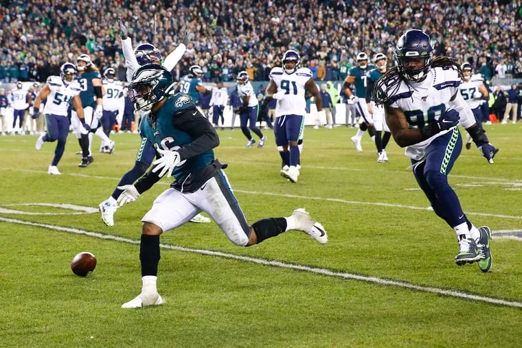 Eagles running back Miles Sanders couldn't hang onto a key pass from Josh McCown in the fourth quarter.