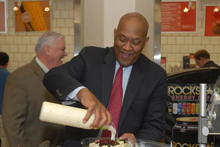 State Rep. Dwight Evans at the Capitol Cafe. The Philadelphia Democrat was enthusiastic about the food and the troubled cafeteria: &quot;Yes! Yes! Yes to all that!&quot; (Bob Williams /For The Inquirer)