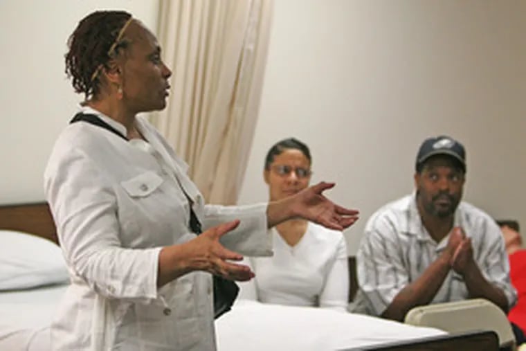 Tonette Moore instructs a class that includes James Phillips and his caregiving girlfriend, Edna Stuart. The nonprofit Liberty Resources Inc. organizes the course.